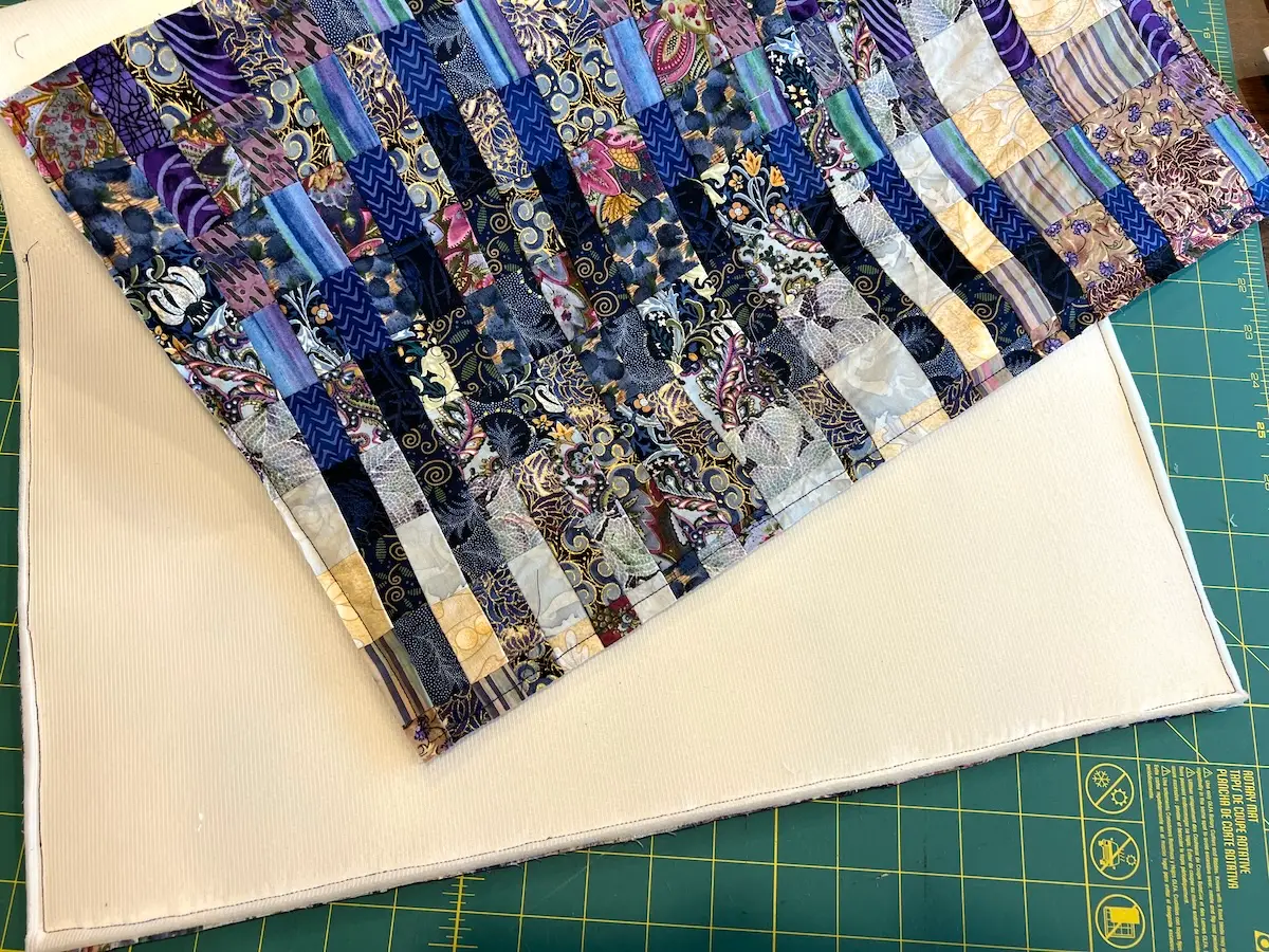 Blue patchwork bag patchwork pieces sewn to the foam