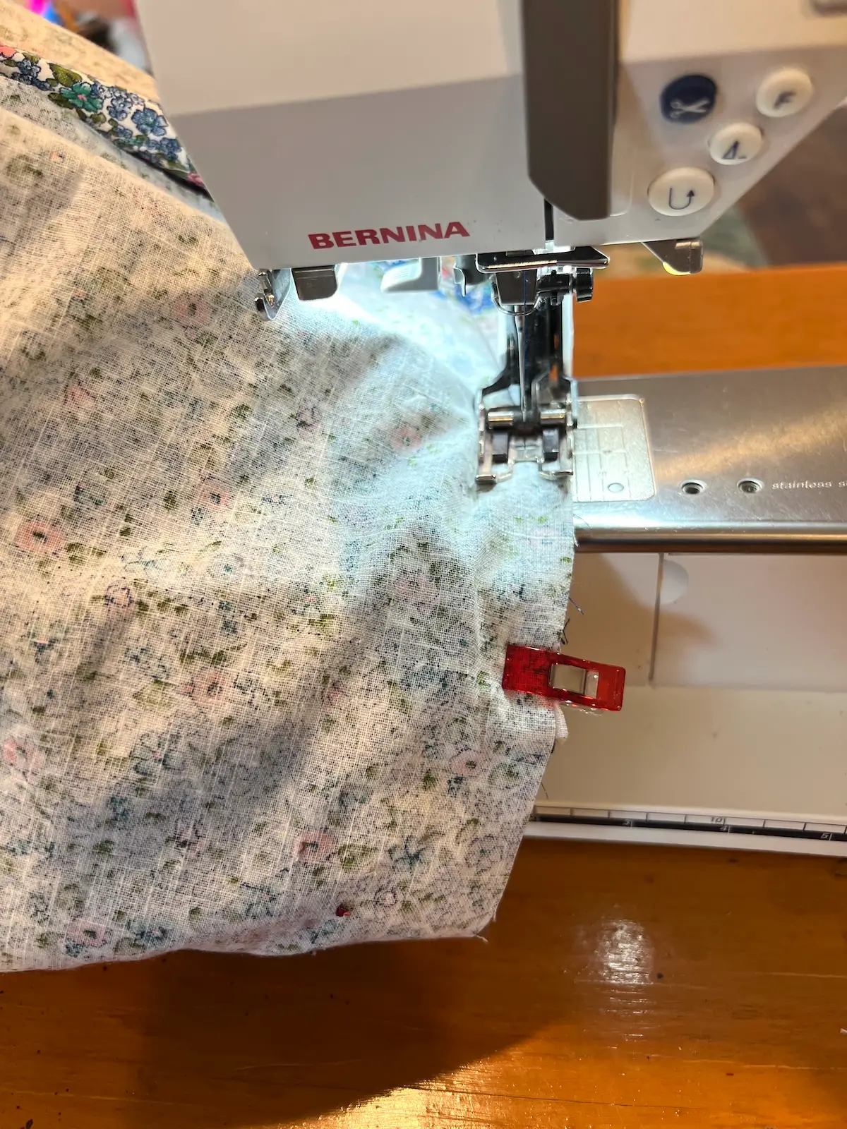 Blue patchwork bag sew around the lining to the outside of the bag around the top