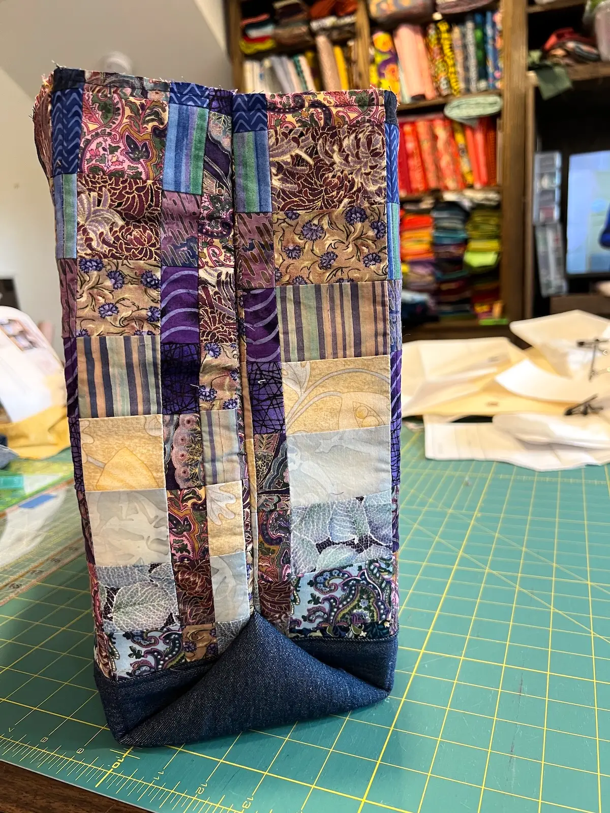 Blue patchwork bag showing the finished sides of the bag