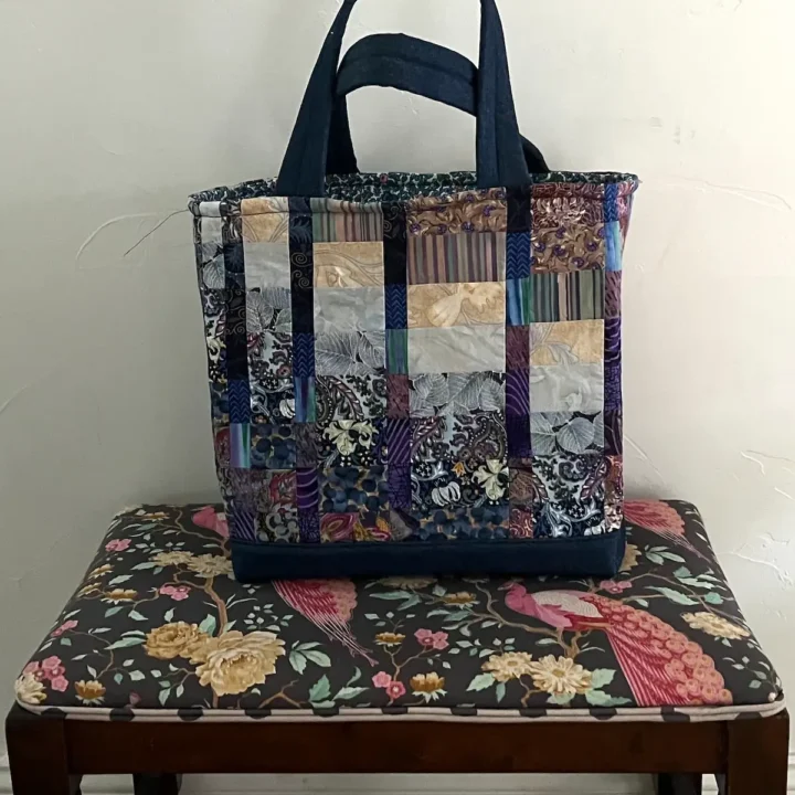 Blue patchwork tote finished on stool