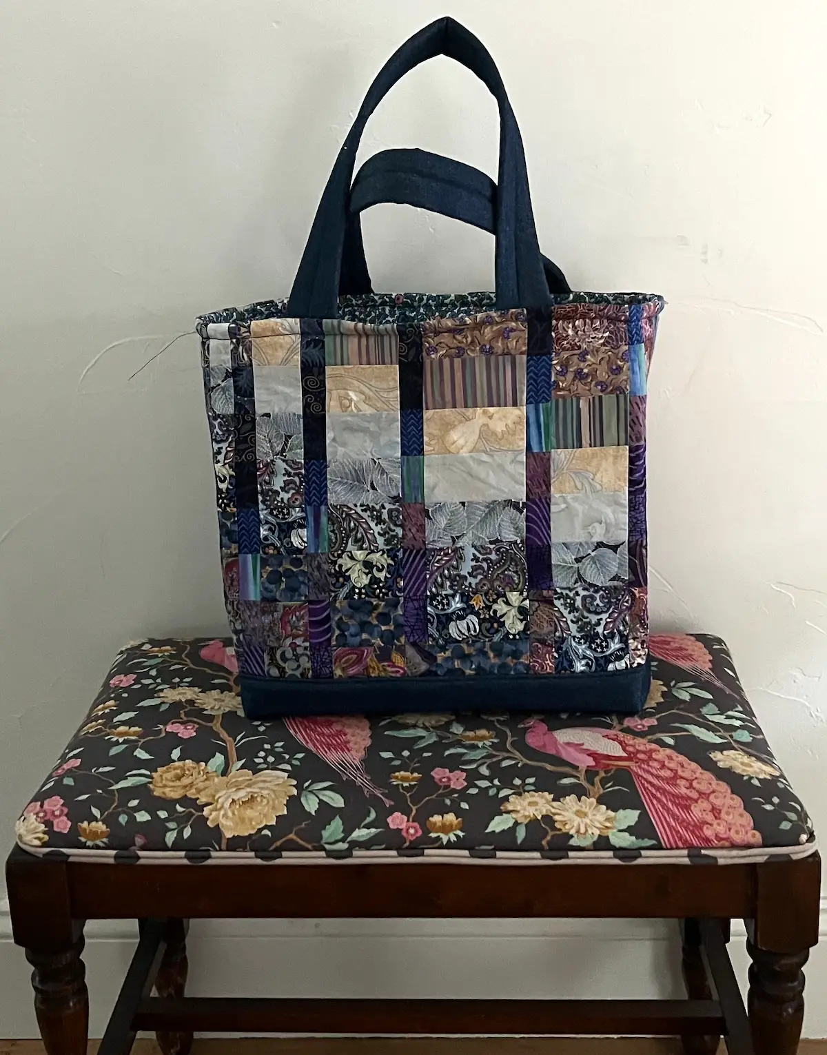 Blue patchwork tote finished on stool