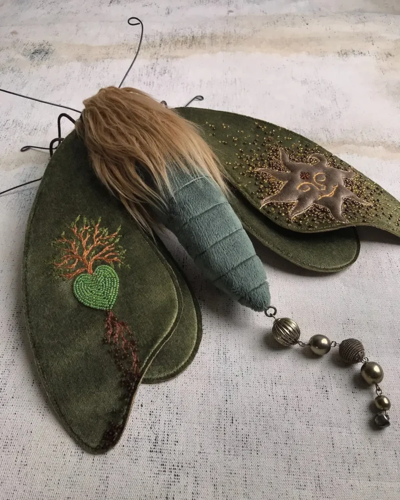 Green heart cloth moth by Larysa Bernhardt