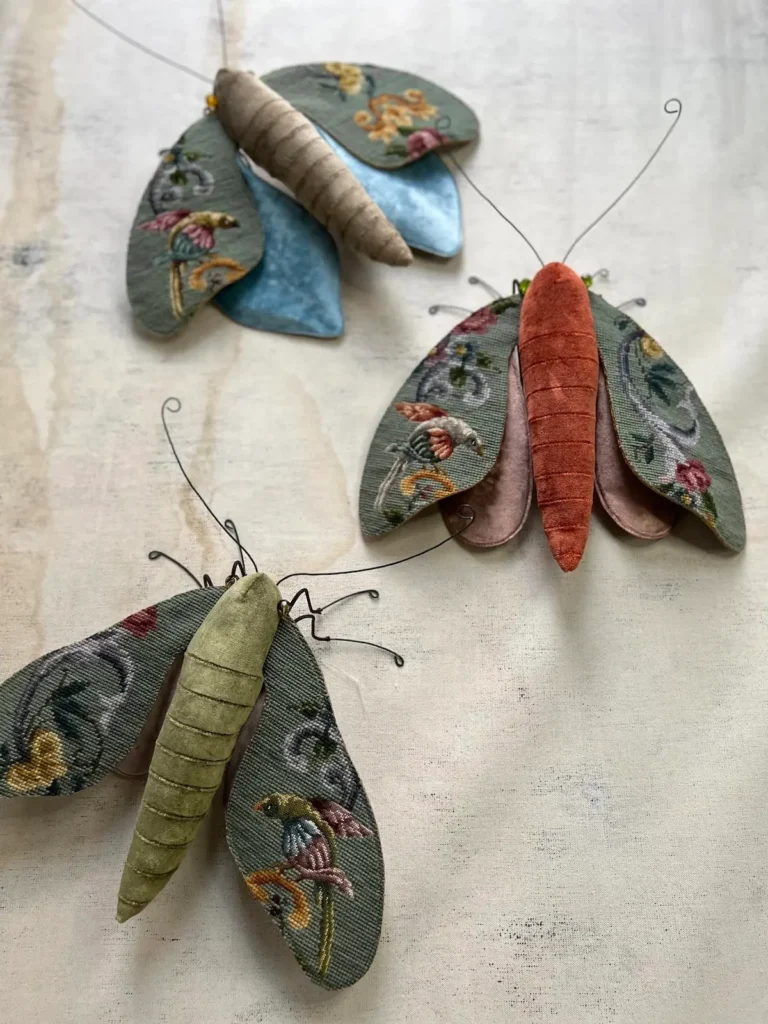 Trio of tapestry cloth moths by Larysa Bernhardt