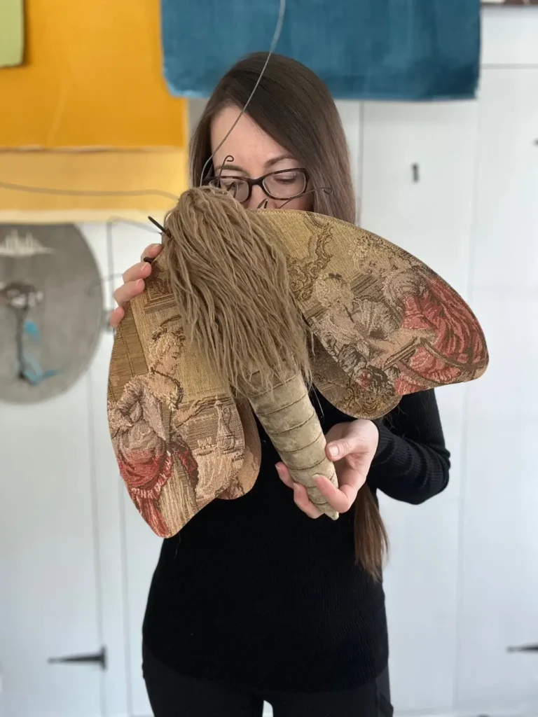 Larysa Bernhart with one of her cloth moths