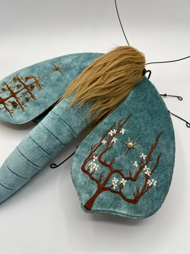 Blue velvet cloth moth by Larysa Bernhart