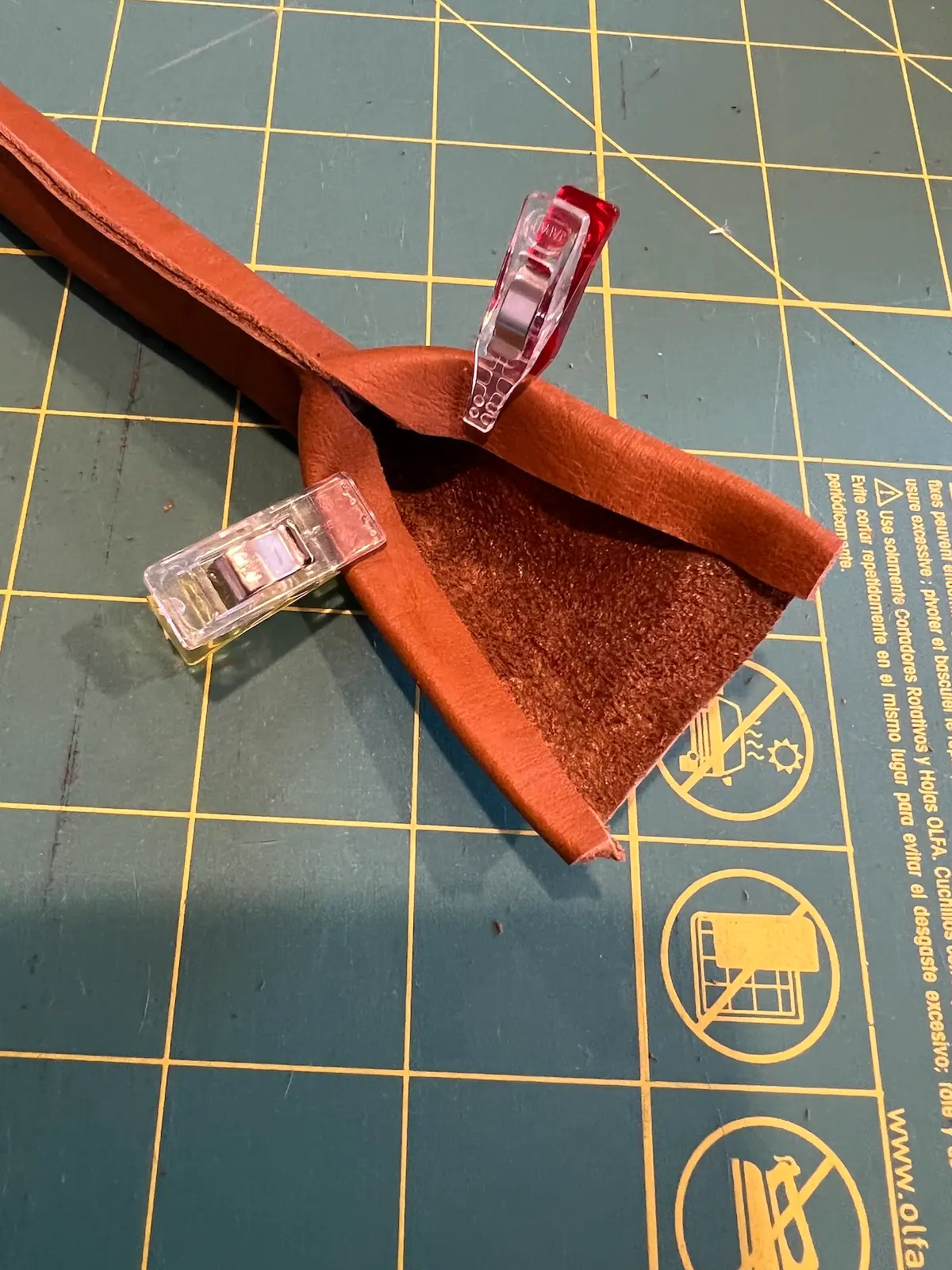 Patchwork tote leather handles fold in the sides and hold with clips