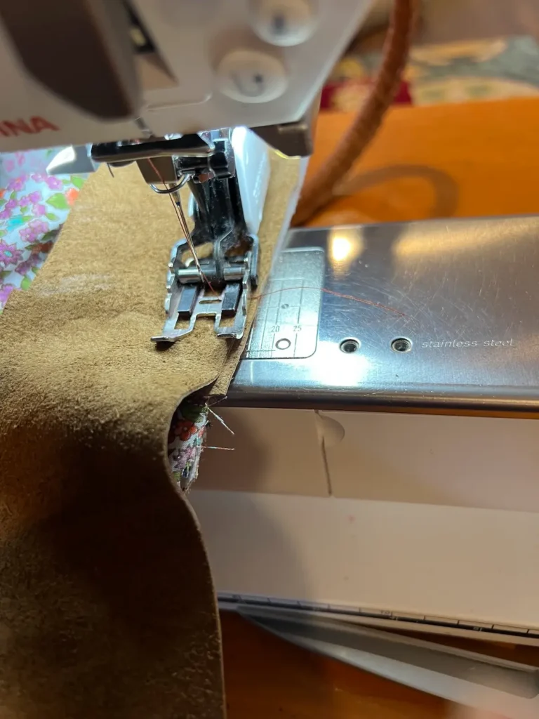 Patchwork tote sewing leather to the inside top of the bag