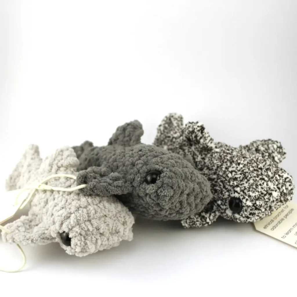 Three crocheted sharks by Avery Tronson