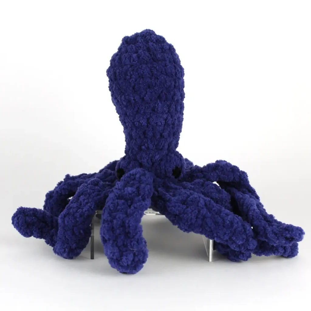 Dark blue baby octopus crocheted by Avery Tronson