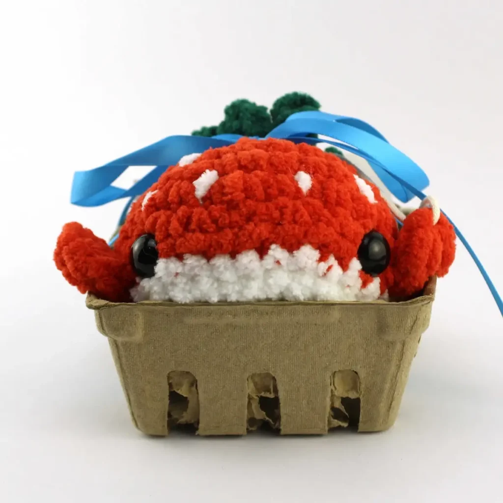 Crochet strawberry in a basket by Avery Tronson
