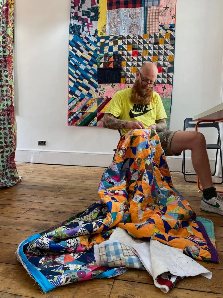 Chris English working on a quilt