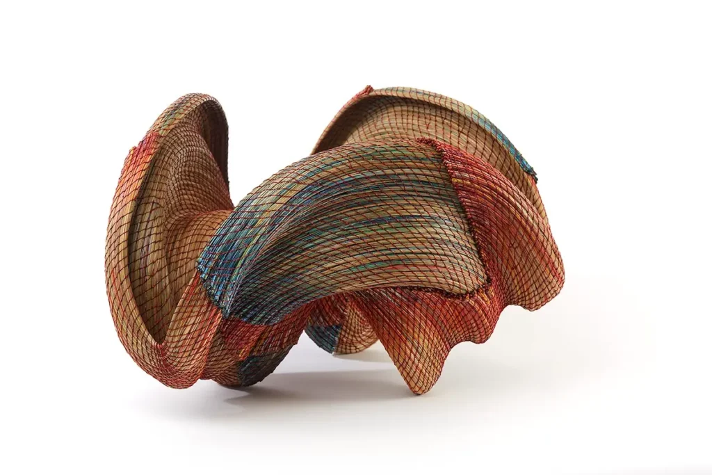Curvy woven 3D pine needle structure by Clay Burnette