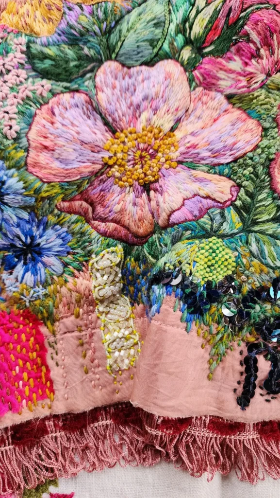 Variegated pink and lavender embroidered flower by Fleur Woods