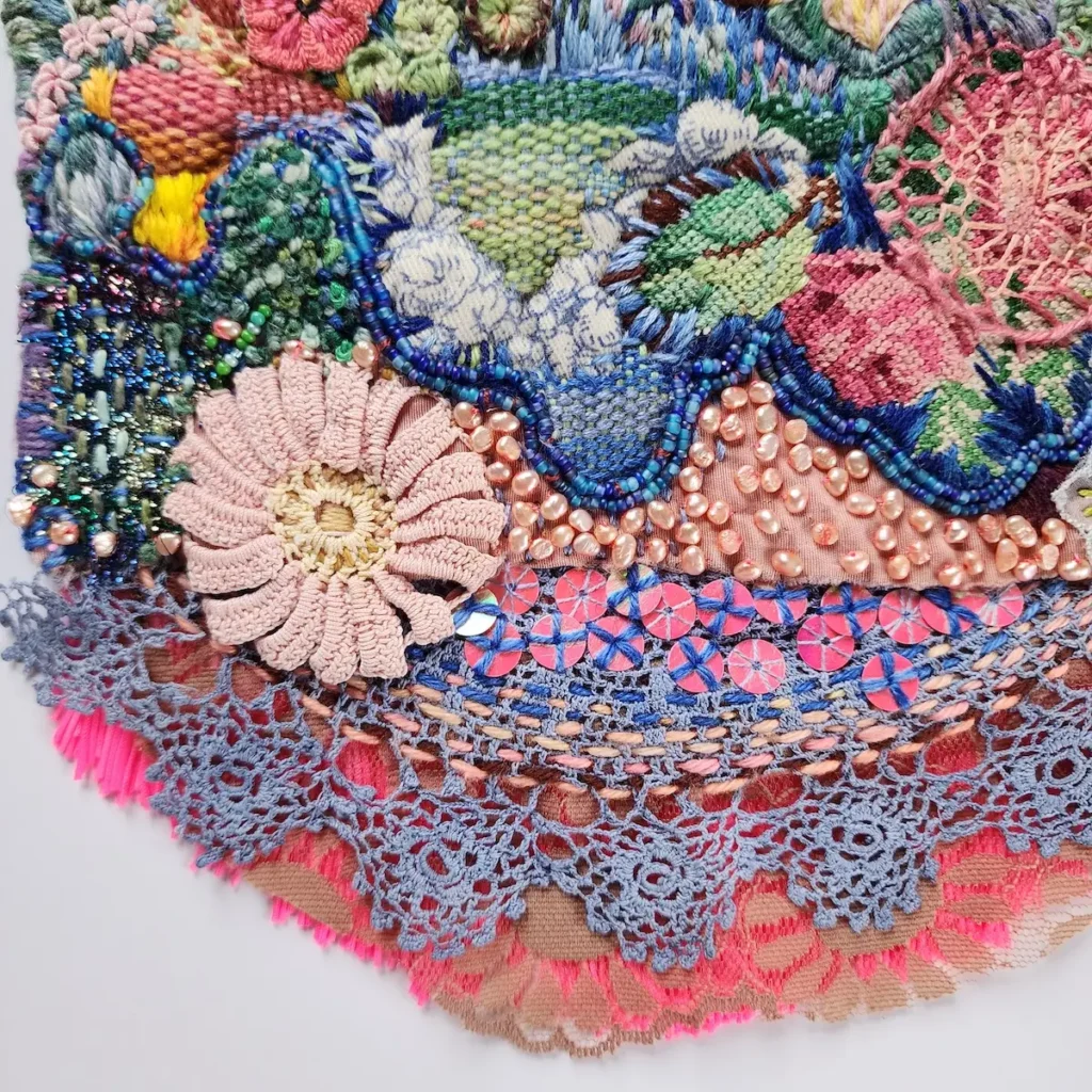 Detail of vintage doilie, beading and more on a piece by Fleur Woods