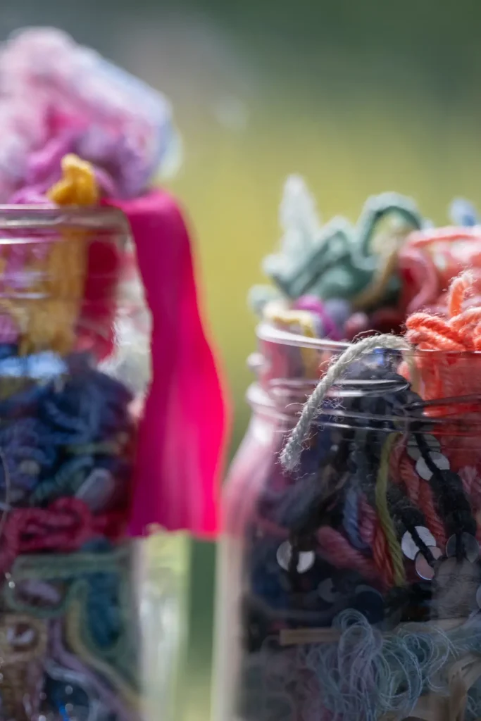 Threads and yarns in mason jars by Fleur Woods