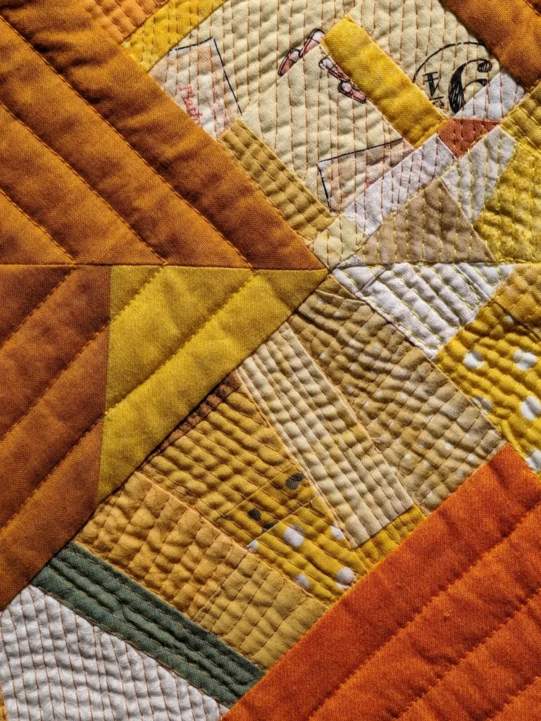Detail of yellow quilt by Kate Sandford