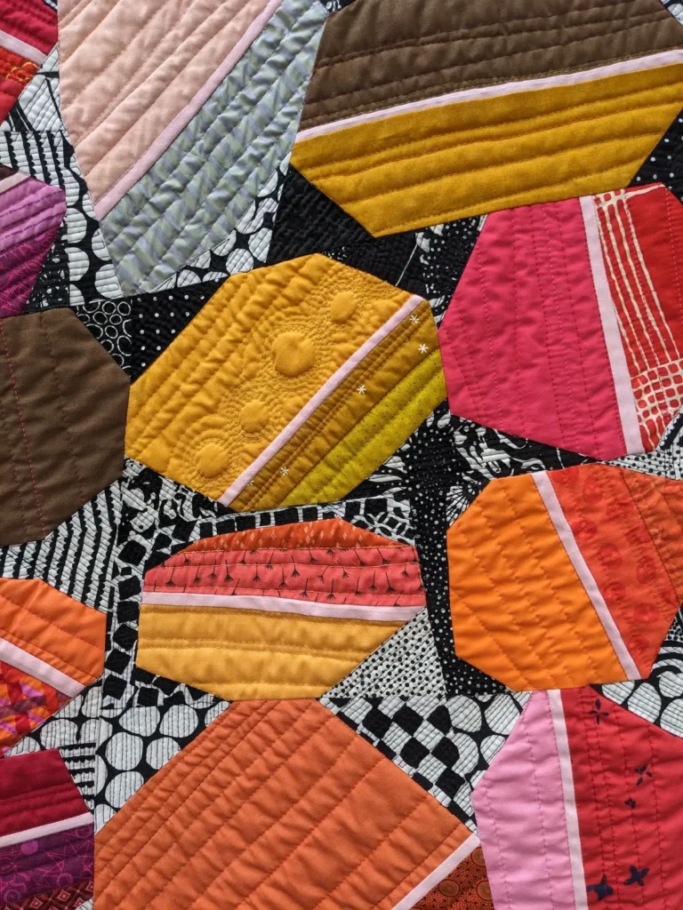 Close up of stitching on a quilt by Kate Sandford