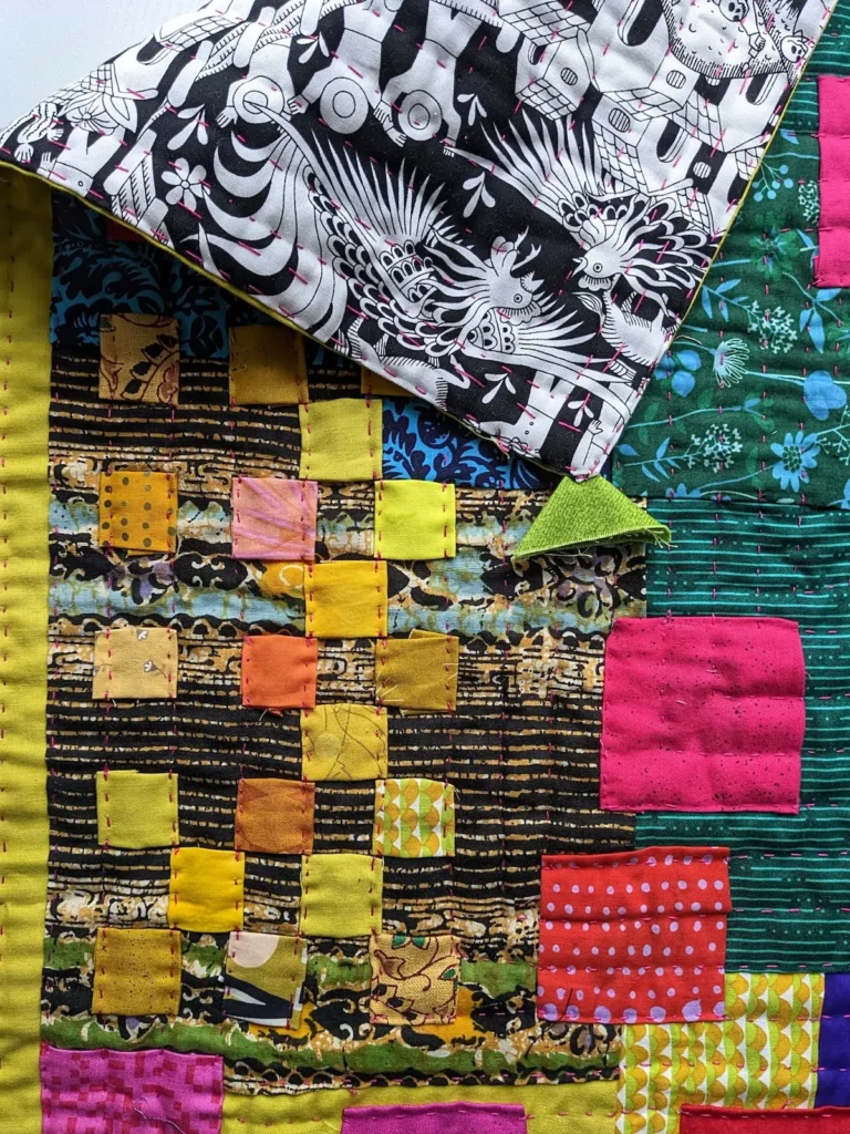 Showing two sides of a quilt by Kate Sandford