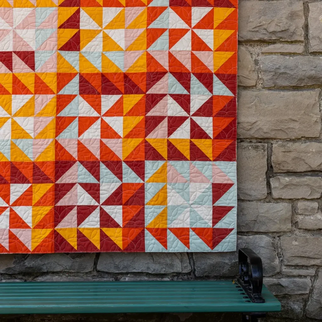 Orange and red quilt by Lilo Whitener-Fey