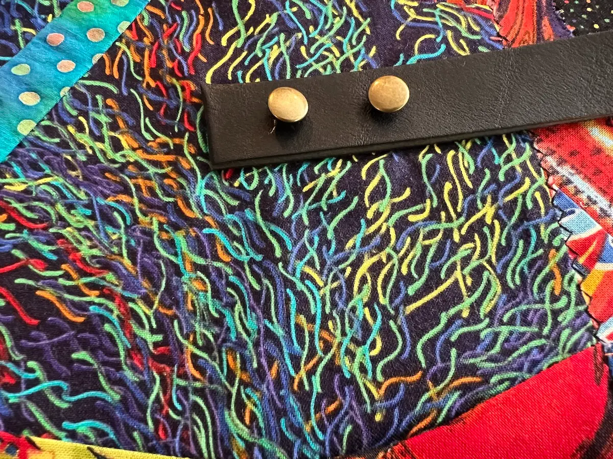Showing the caps on the rivets for the patchwork bag