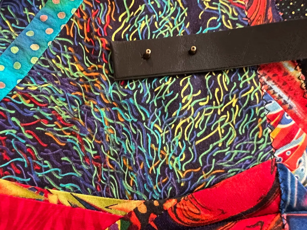 Handles place on the patchwork bag ready for the caps