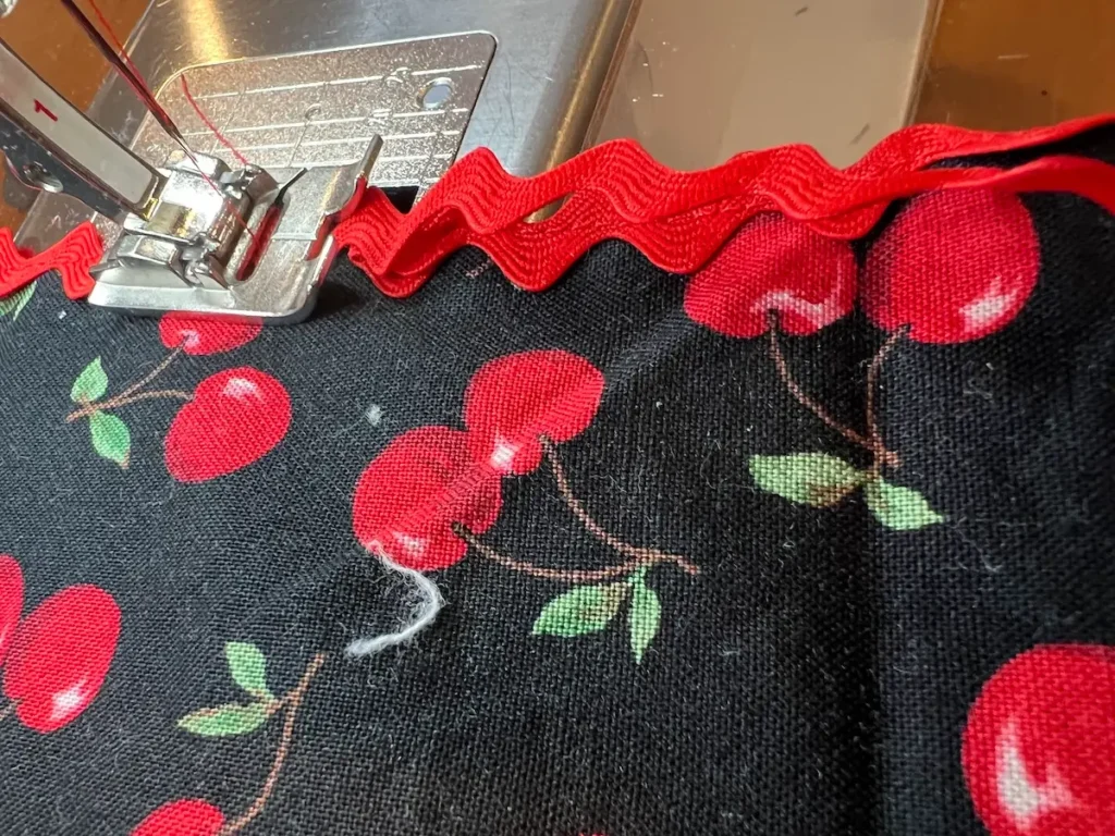 Overlap the rick rack when you get to where you started on the napkin