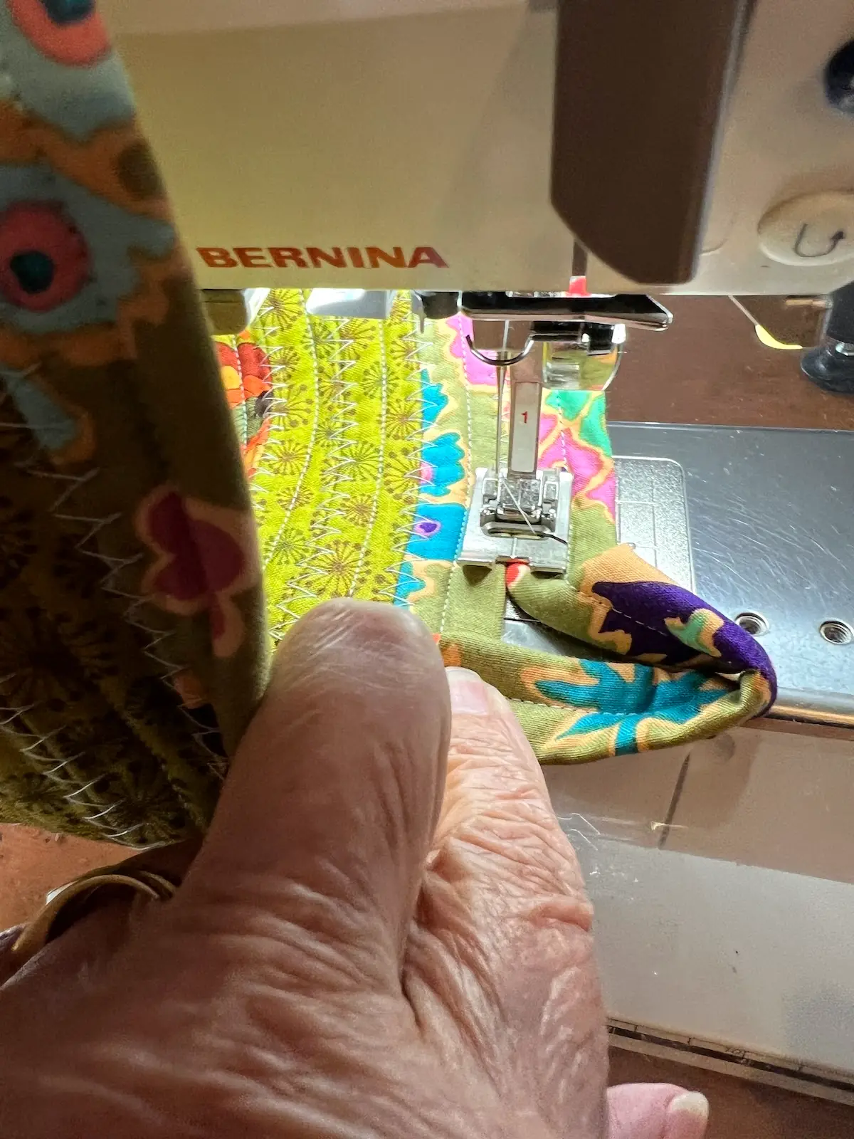 Fabric tube basket making a loop to finish the basket