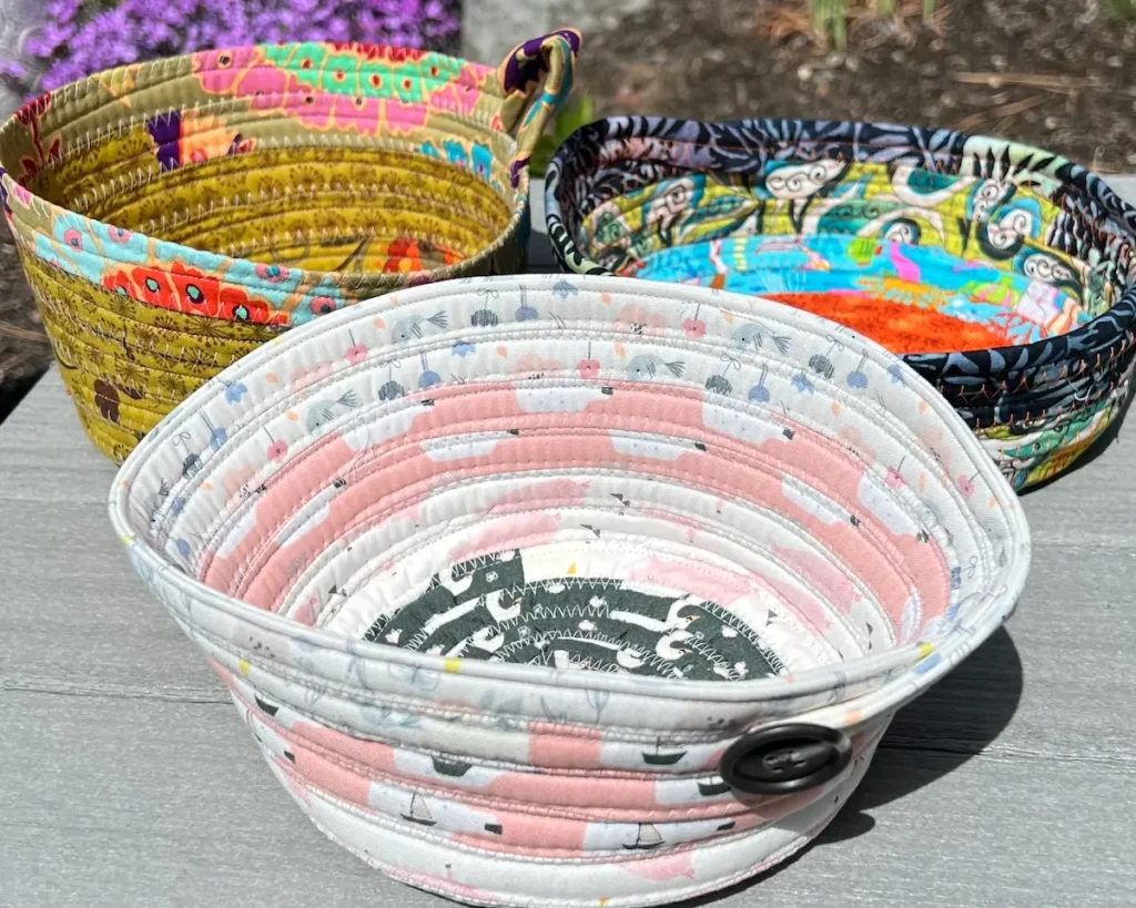 Fabric tube baskets set of three finished with button one in front
