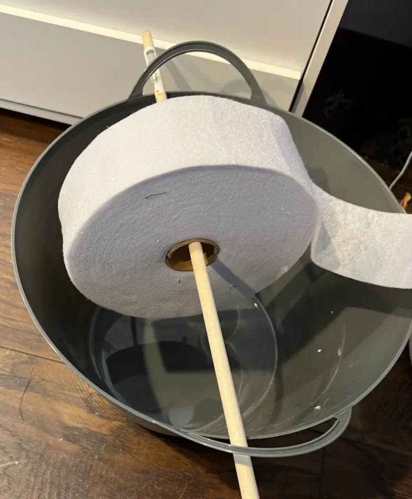 Fabric tube tip to place the batting on a dowel in a basket