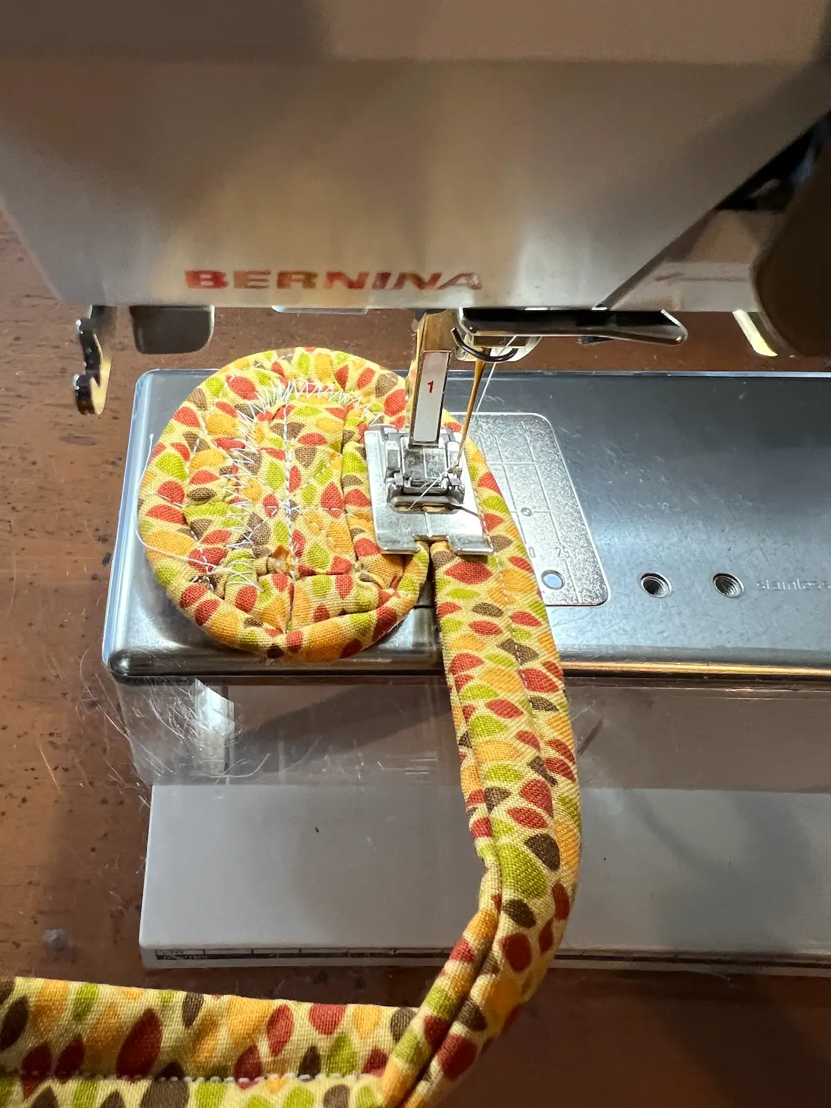 Fabric tube with tool beginning to sew the rounds