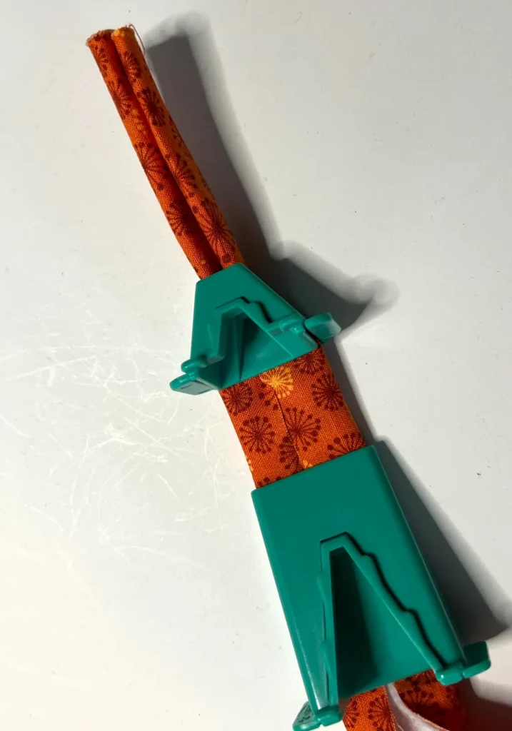 Fabric tube with tool in progress showing how each of the pieces works