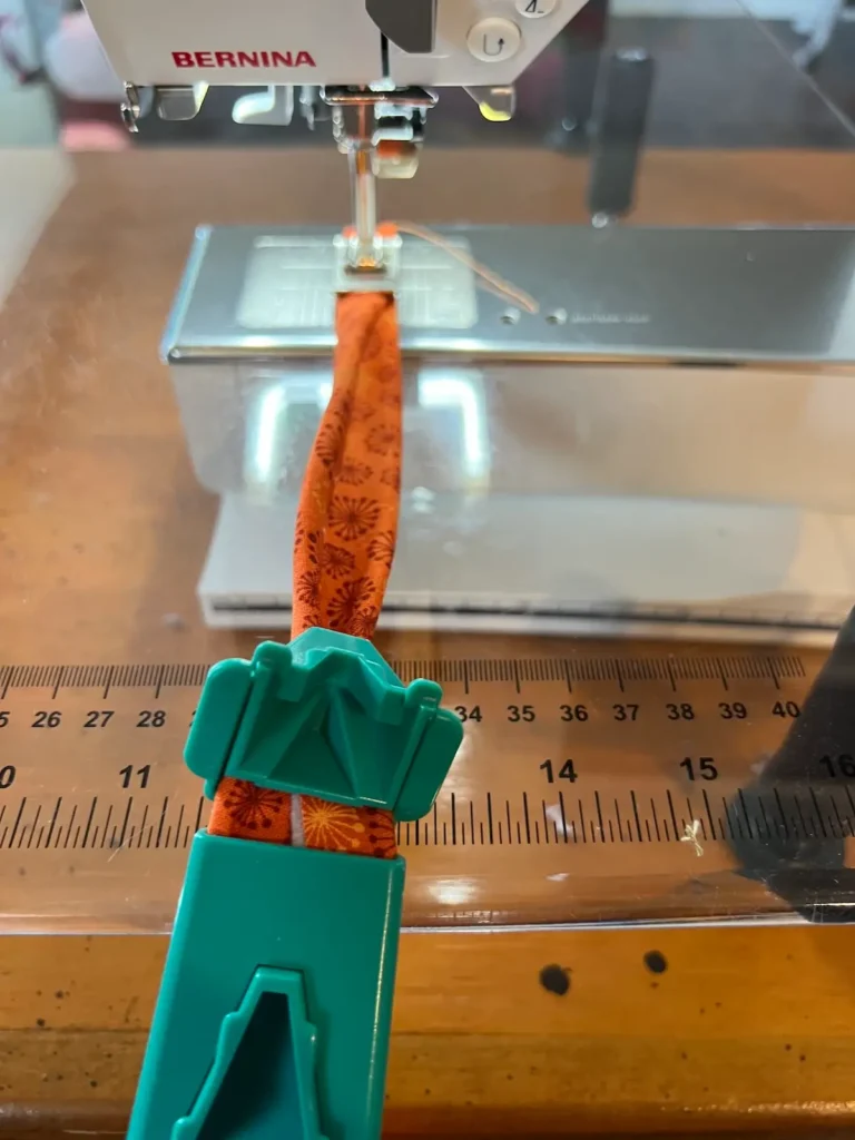 Fabric tube with tool showing how the two piece tool works