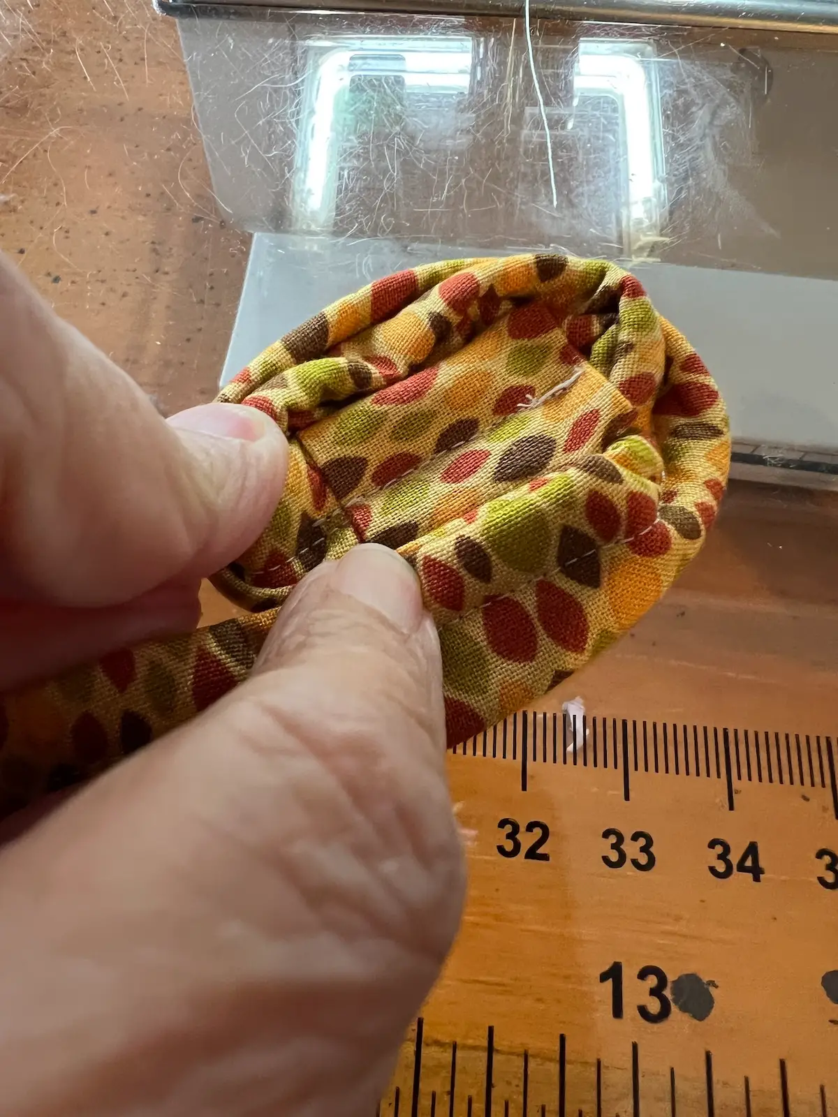 Fabric tube with tool showing how to start a circle basket