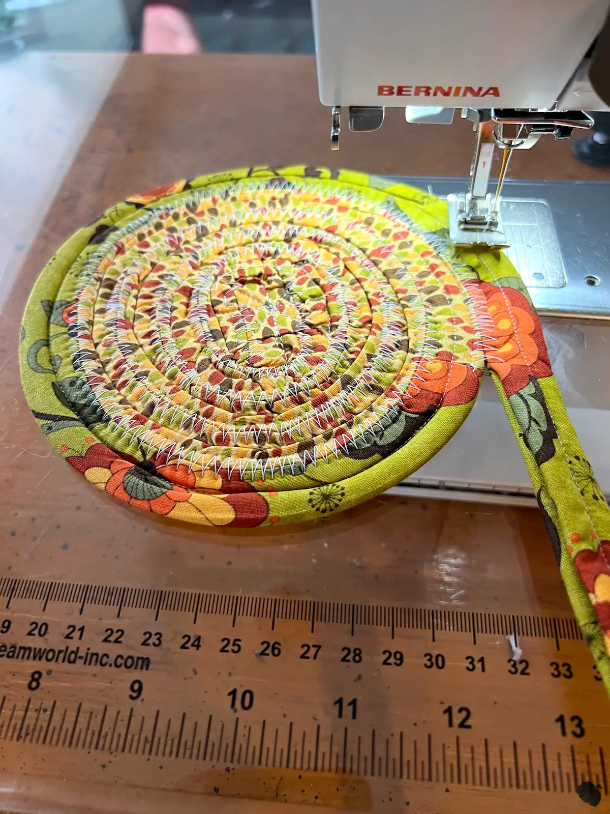 Fabric tube with tools almost finished with the bottom