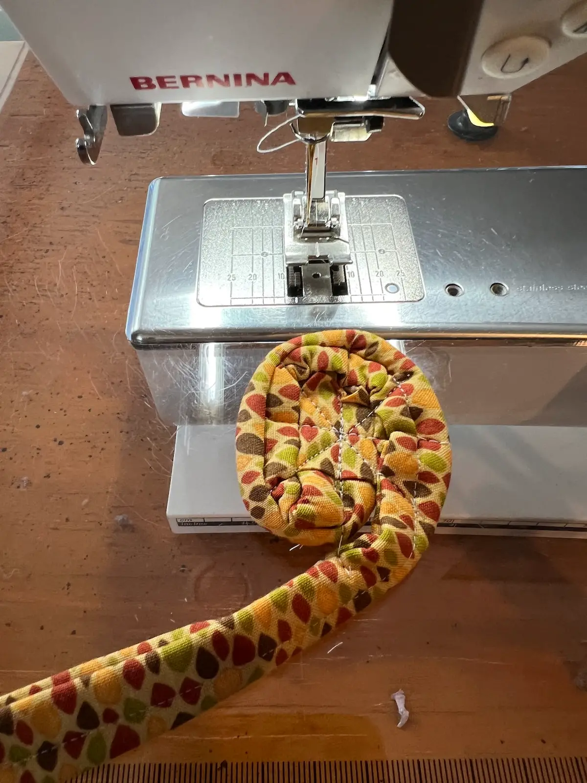 Fabric tube with tools showing the start of the center of the bowl