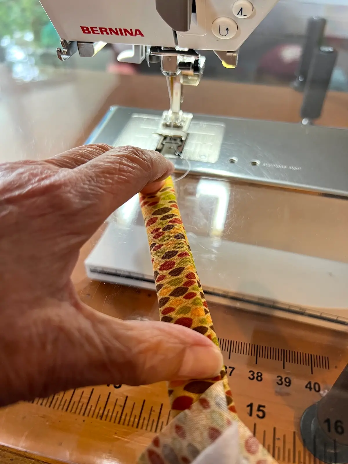 Fabric tubes fold the fabric wrapped batting in half