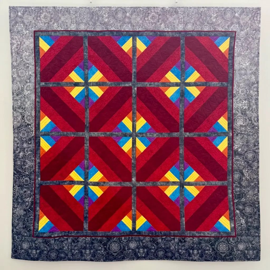 Crimson Dancer quilt by Leanne McGiveron
