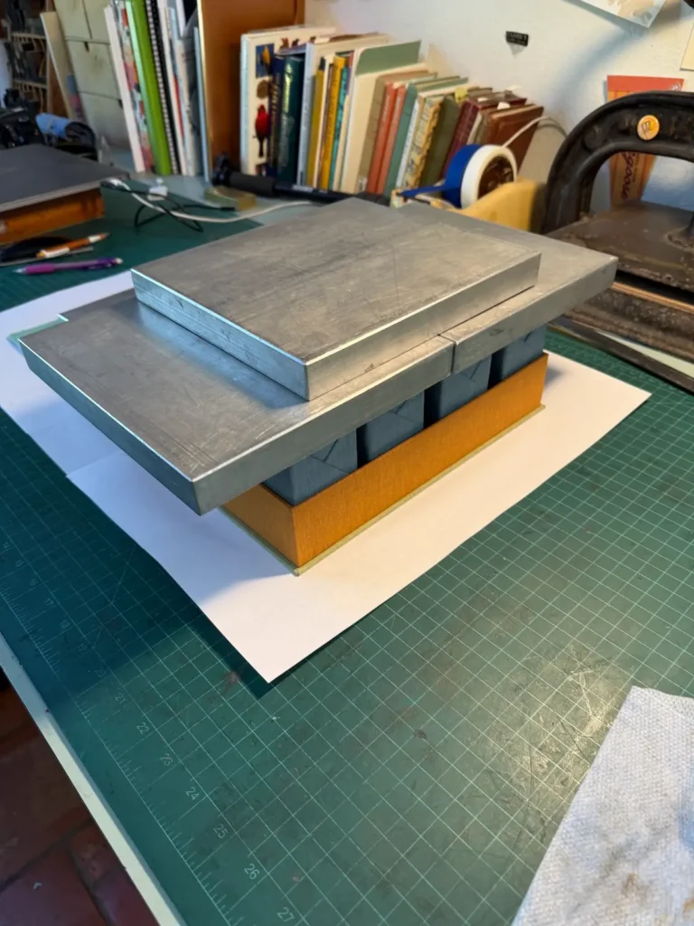 Weights on boxes for Listen book by Rebecca Chamlee