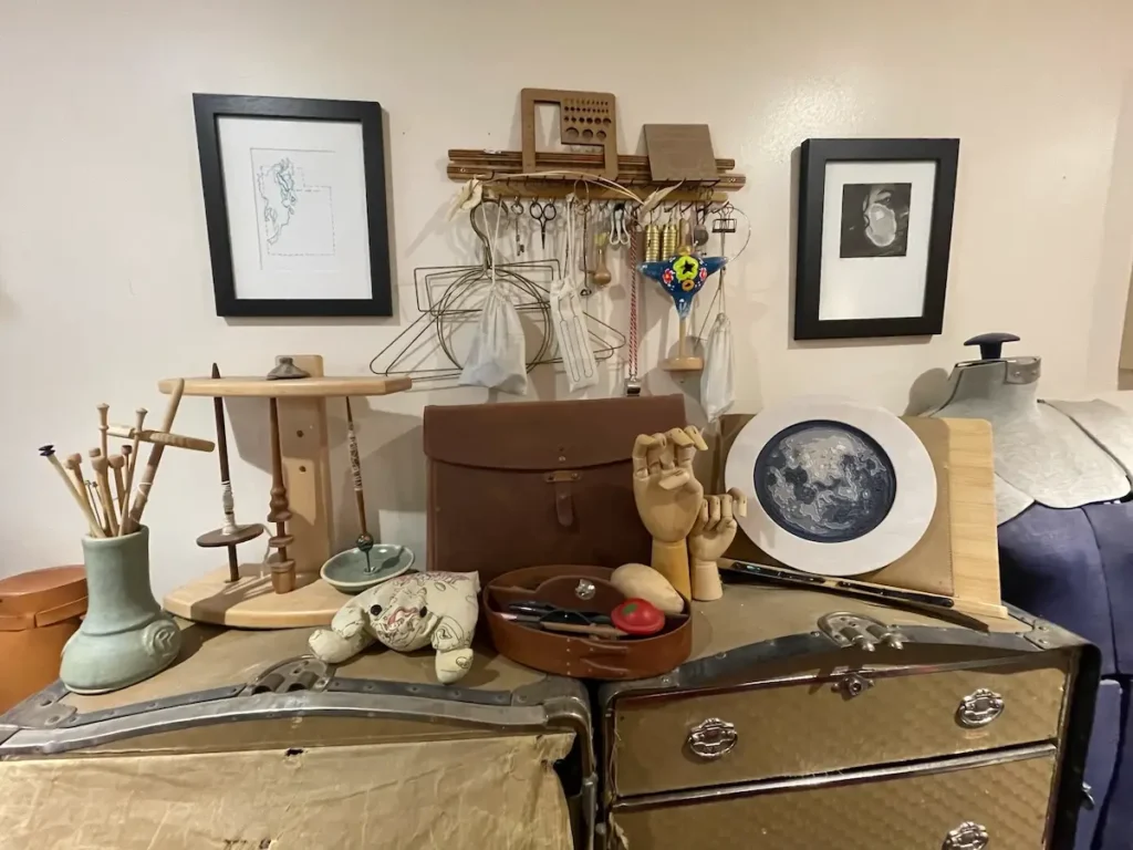 Wall of knitting supplies in Virginia Catherall studio