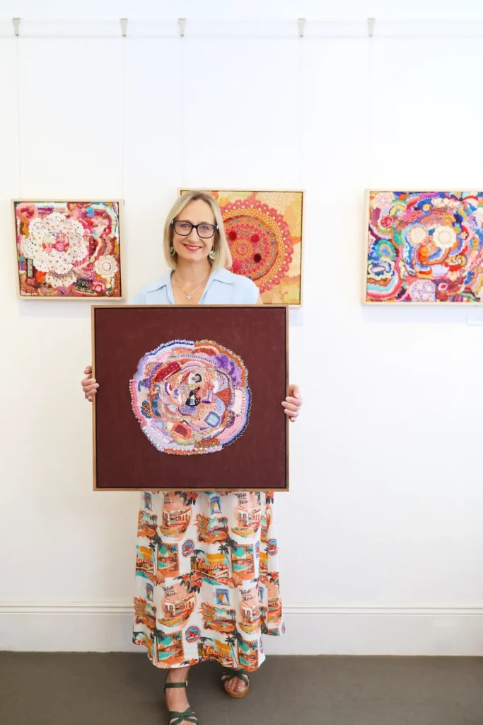 Elizabeth Sullivan with several of her artworks