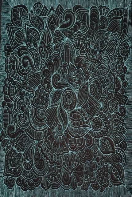 Black with pale blue stitched quilt by Karlee Porter