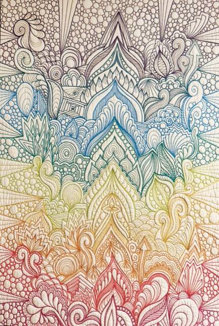 White with black, blue, green, yellow and orange stitching quilt by Karlee Porter