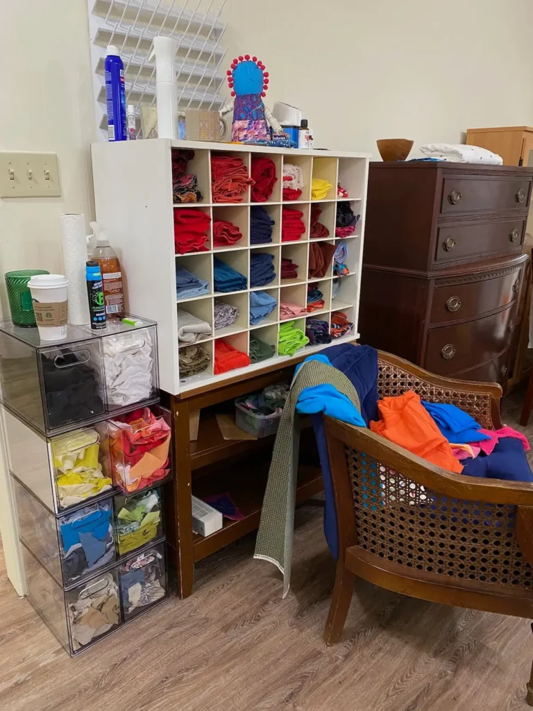 Lela O'Dell's studio showing fabric in cubbies