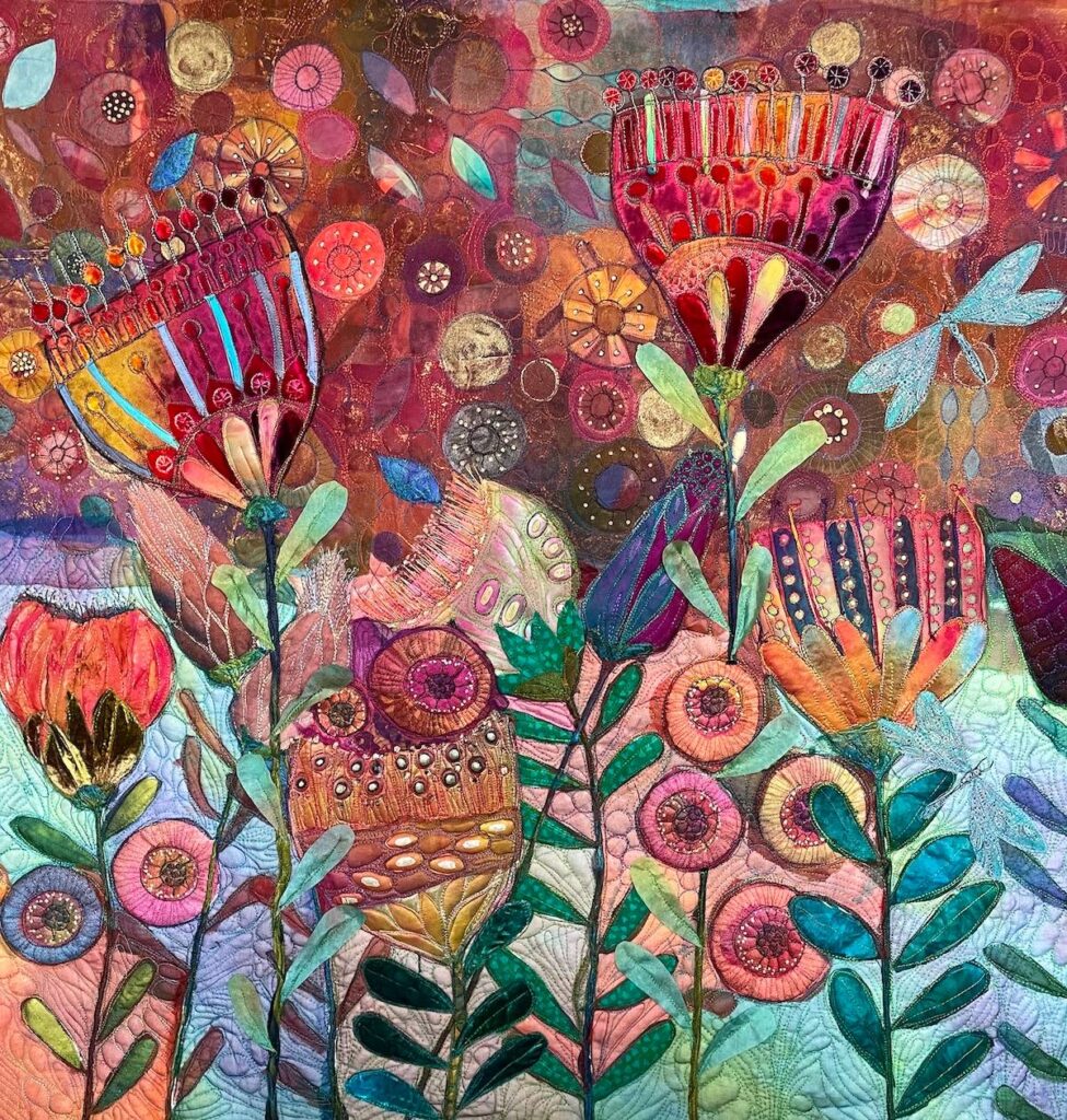 Flower art quilt on teal and red background by Michelle Mischkulnig