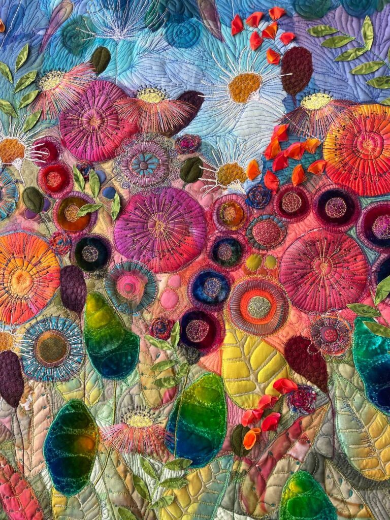 Colorful flower art quilt by Michelle Mischkulnig