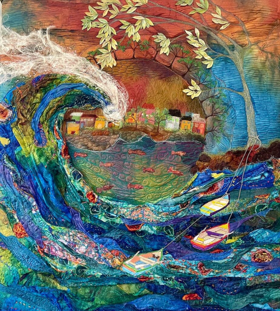 Art quilt by Michelle Mischkulnig with the ocean, fish and boats