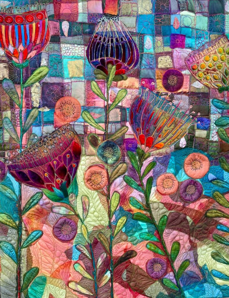 Art quilt by Michelle Mischkulnig with flowers on a blue patchwork background