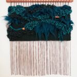 Teal weaving on a copper pipe by Adriene Busch