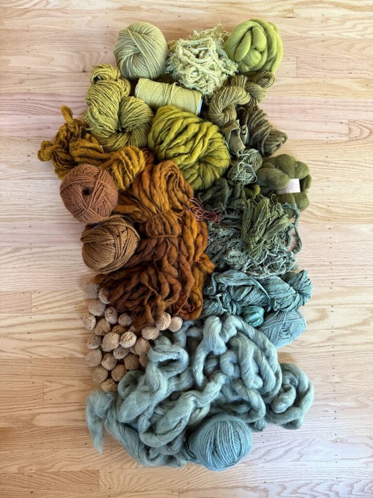 Bundle of fibers ready to be made into a tapestry by Adriene Busch