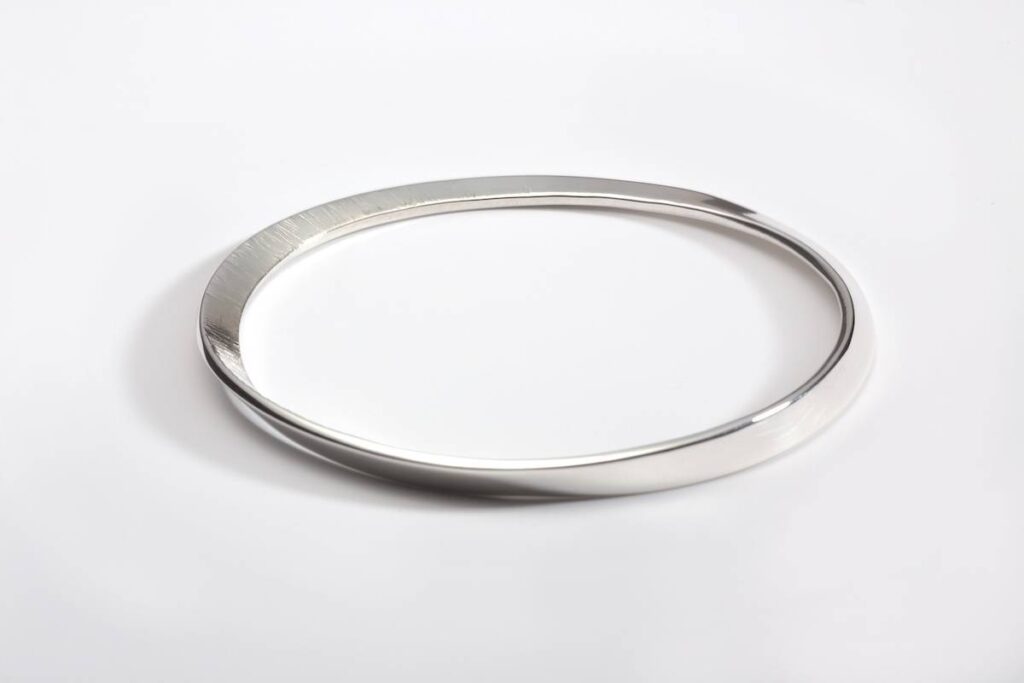 Silver Mobius bangle by Emma Jane Champley